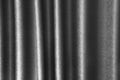 Abstract wavy fabric texture surface, curtain wave pattern background, macro texture of gray striped fabric