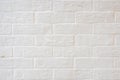 Abstract weathered textured white brick wall background. Brickwork stonework interior, rock old clean concrete grid uneven