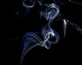 Abstract white blue smoke from aromatic sticks. Royalty Free Stock Photo