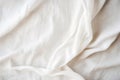Abstract white crumpled linen background. Creased wrinkled white fabric, bedding sheets, white blanket texture