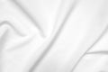 Abstract white fabric texture background. Cloth soft wave. Creases of satin, silk, and cotton. Royalty Free Stock Photo