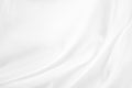 Abstract white fabric texture background. Cloth soft wave. Creases of satin, silk, and cotton. Royalty Free Stock Photo