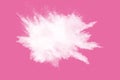 Abstract white powder explosion on pink background. Freeze motion of white dust splattered Royalty Free Stock Photo