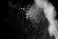Abstract white powder explosion.White dust debris on black background Royalty Free Stock Photo