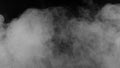 Abstract white puffs of smoke swirls overlay on black background Royalty Free Stock Photo
