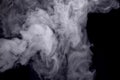 Abstract white smoke against dark background Royalty Free Stock Photo