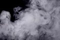 Abstract white smoke against dark background Royalty Free Stock Photo