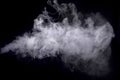 Abstract white smoke against dark background Royalty Free Stock Photo