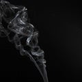 Abstract white smoke swirls pattern over the black background Royalty Free Stock Photo