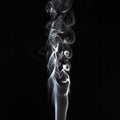 Abstract white smoke swirls pattern over the black background Royalty Free Stock Photo