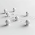 Abstract white spheres connected by thin rods on minimalist surface Royalty Free Stock Photo