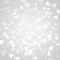 Abstract white triangle shapes overlap on gray background.