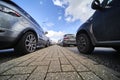 Abstract wide angle image of a pavement between cars in the queue