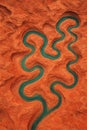 Abstract Winding River Through Textured Orange Canyon Top View AI-GENERATED Royalty Free Stock Photo