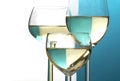 Abstract wine glasses, background half blue, half white, copy sp Royalty Free Stock Photo