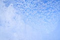 Abstract winter background. Frost on a frozen window against the blue sky. Royalty Free Stock Photo