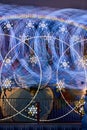 Abstract winter wonderland carnival ride detail of lights blurred forming circles and snowflakes