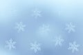 Abstract wintry background: snowflakes on blue surface Royalty Free Stock Photo