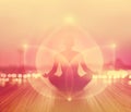 Abstract woman was meditating in sunrise and rays with energy of light on landscape, soft and blur Royalty Free Stock Photo