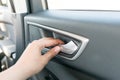 Abstract women hand opening the car door, Closeup of a hand selective focus and with a very shallow depth of field.