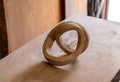 Abstract wooden sculpture with shapes and waves in the workshop of the sculptor and artist. Arts and crafts