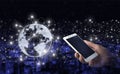 Abstract world network connection, internet and global connection concept. Hand hold white smartphone with digital hologram world