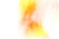 Abstract yellow orange powder explosion on white background. Freeze motion of yellow orange dust particles splash Royalty Free Stock Photo