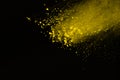 Abstract of yellow powder splatted background,Freeze motion of c Royalty Free Stock Photo