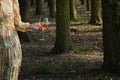 Young woman with Glass of Rose Wine in Forest Royalty Free Stock Photo