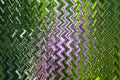 Abstract zigzag pattern with waves in purple and green tones. Artistic image processing created by flowering purple wisteria photo