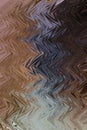 Abstract zigzag pattern with waves in sandy, brown, blue tones. Artistic image processing created by photo of Mujib River canyon