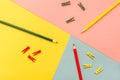 Abstracted are colored pencils and clips on yellow, green, red Royalty Free Stock Photo