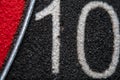 abstraction background with part of an old darts board with the number 10 on a black background Royalty Free Stock Photo