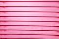 Abstraction background. Vertical bright stripes of plastic trays stacked in different colors, structures