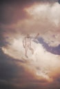 Abstraction of a electricity man from a wire in front of a stormy cloudy sky. Concept Royalty Free Stock Photo