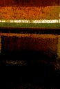 Abstraction from an image of the side of a rusty boat moored in the water of a harbour marina