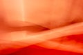 Abstraction, interweaving of waves and folds, red orange background