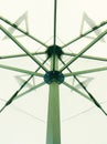 The pattern of steel frame umbrella underside detail with white cloth roof Royalty Free Stock Photo