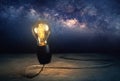 abstrract bright light bulb standing with Milky way background, Royalty Free Stock Photo