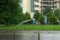The person fulfills the obligations of the contract in any weather, even if it is absurd. Watering the city lawns in the rain