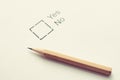 absurd vote concept - choice with no choice Yes or NO - checkbox on white paper with pencil. Toned.