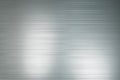 Abtsract background with light grey polished metal horizontal lines with light spots Royalty Free Stock Photo