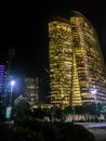 Abu Dhabi city business tower lights at night, UAE