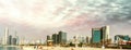 Abu Dhabi panoramic skyline at sunset as seen from Corniche Beach Royalty Free Stock Photo