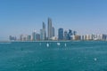 Abu Dhabi Skyline with sailboats and birds Royalty Free Stock Photo