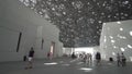 Interior of the new Louvre Museum in Abu Dhabi showing reflections of the Rain of Light dome