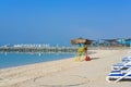 Public family beach with huge hashtag sign on background in Abu Dhabi recreation center of Hudayriyat Island,UAE