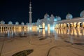 Abu Dhabi, UAE - 11.03.2017: Night at the courtyard of Grand Mosque of Abu Dhabi. Sheikh Zayed Grand Mosque.Marble floor