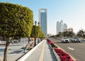 Street in Abu Dhabi with ADNOC on the background.