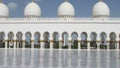 Abu Dhabi, United Arab Emirates. The Great Mosque is reflected in the polished marble. Royalty Free Stock Photo